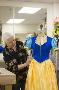 Marilyn Wojdak works on a dress in the current Klein Theatre production of "Vanya and Sonia and Masha and Spike."