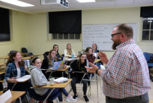Associate Professor of Education John Broome with his class. Photo by Norm Shafer.