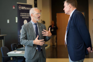 President Troy Paino talks with Sen. Mark Warner. They both attended the 3rd Annual Cybersecurity Summit at UMW's Stafford campus on May 3.