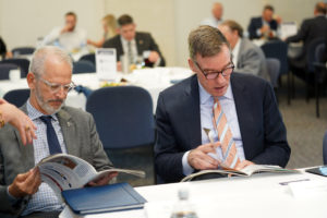 President Troy Paino talks with Sen. Mark Warner. They both attended the 3rd Annual Cybersecurity Summit at UMW's Stafford campus on May 3.