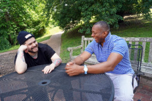 Chef Erik Bruner-Yang '07 shares a laugh with his mentor, Associate Vice President and Dean of Student Life Cedric Rucker. Photo by Suzanne Rossi.