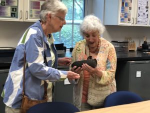 Fredericksburg's local Questers chapter, 1944, visited UMW's Department of Historic Preservation this week. Here, two members of the group examine a Civil War ordnance that was found by UMW HISP students at Sherwood Forest plantation.