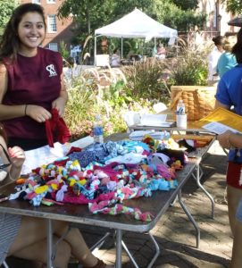 COAR members make dog toys for sheltered pets at Into the Streets. 