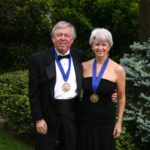 Bill Crawley and wife Terrie Young Crawley '77 show off their Washington Medallions, recognizing extraordinary service to the University.