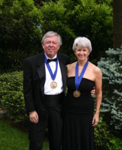 Bill Crawley and wife Terrie Young Crawley '77 show off their Washington Medallions, recognizing extraordinary service to the University.