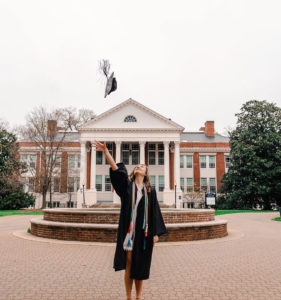 Class of 2020 graduate Camryn Molnar tosses her cap in front of Monroe Hall and the Palmieri Fountain. She’s among the 1,309 UMW graduates who will participate in commencement in the fall. The combined undergraduate and graduate ceremony is currently scheduled for October 24. Photo credit: dpan.visuals on Instagram.