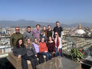 Professors David Rettinger (back row, left) and Dan Hirshberg (back row, right) with students on a study abroad trip to Nepal.