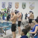 From left to right: Anderson, Brian O'Donnell '12 and Austin Clark '12 about to begin the 100 freestyle at the conference championships in 2010, the last individual race of Anderson's career.