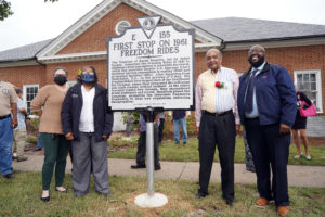Posing with the historical marker, from left to right, James Farmer Multicultural Center Associate Director JoAnna Raucci and Director Marion Sanford, Freedom Rider Dion Diamond and Assistant Director Christopher Williams. Photo by Suzanne Carr Rossi.