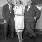 Violet Popovich is flanked by her two attorneys in a Chicago courtroom on July 15, 1932, nine days after she shot her former lover, Chicago Cub shortstop Billy Jurges. Note her bandaged left arm; she herself was accidentally shot as the two struggled for the gun. Photo courtesy of Bill Hageman.