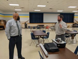 Washington & Lee High School Assistant Principal Wilfredo Hernandez (left) and the Naval Surface Warfare Center Dahlgren Division’s Director of Academic Engagement Michael Clark discuss the parameters of the Innovation Challenge @ Dahlgren. Washington & Lee High School in Montross was the first to accept the challenge, designed to highlight the importance of STEM education.