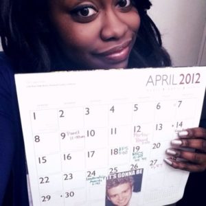 A decade ago, UMW alumna Kianna Davis ’13 created the famous ‘It’s Gonna Be May’ meme, which has since become a cultural phenomenon. Here, she shows off her April 2012 calendar from her junior year, which includes Mary Washington events such as Mortar Board and the Leadership Awards. Photo courtesy of Kianna Davis.