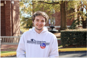 Student Carl Horkan proudly sported a first-time voter sticker during UMW’s Day on Democracy. Paige Shiplett photo.