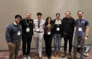 UMW students Ricky Muñoz, left, and Kaleb Dunlap, third from left, pose with Southeast Division AAG teammates at the recent World Geography Bowl in Denver. They were selected for the team based on their showings at a fall 2022 SEDAAG competition.