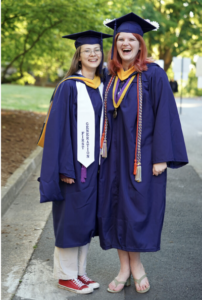 Megan Sullivan (left) received a master’s degree in elementary education and Sara Roberts received a bachelor’s degree in psychology during the University of Mary Washington’s 112th Commencement ceremony. Photo by Suzanne Carr Rossi.
