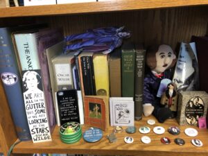A bookshelf of Wilde-related paraphernalia
