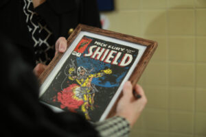 One of Duke Stableford’s embroidered creations inspired by Stan Lee’s comic book covers. Stableford, a 1981 alum who passed away in January, created 30 needlepoints of Marvel Comics covers that will be on display in George Washington Hall before the Great Lives lecture on Stan Lee on Thursday. Photo by Karen Pearlman.