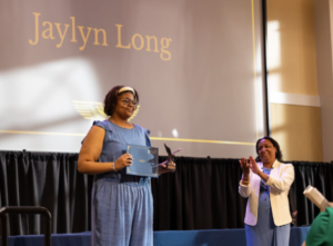 Dean of Students Melissa Jones (right) presents the prestigious Grace Mann Launch Award to senior Jaylyn Long. Last week’s Eagle Awards ceremony recognized students and other members of the University community for their commitment to citizenship, philanthropy, academic excellence, community service and more. Photo by Sam Cahill