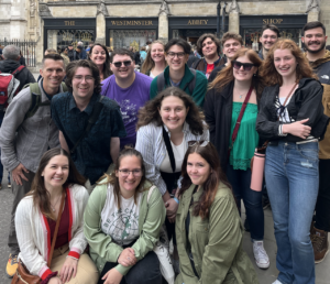 Nathaniel Huff &rsquo;24 (center, green shirt and glasses) and his classmates visit Westminster Abbey during the UMW Theatre in London trip in summer 2023. Nathaniel was able to take the trip because he received the Beyond the Classroom Education Abroad Scholarship, which was awarded for the first time last year. Photo courtesy of UMW Theatre.