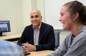 Professor of Communication Anand Rao (pictured L) designed the “Intro to AI” class to equip new and returning UMW students with foundational knowledge about how AI works, how to integrate it into their work and approach it with critical awareness. Photo by Norm Shafer.