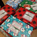 No need to wrap, COAR students wrap gift boxes at the annual wrapping party to prepare for the campus-wide gift drive.