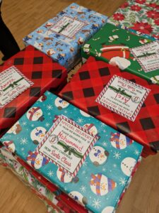 No need to wrap, COAR students wrap gift boxes at the annual wrapping party to prepare for the campus-wide gift drive.