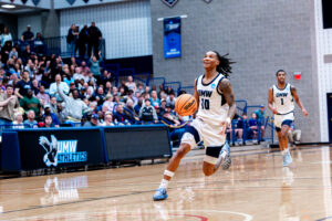 Photo of UMW basketball player going to the basket
