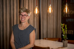 photo of Professor of Sociology Leslie Martin in a black and while striped shirt