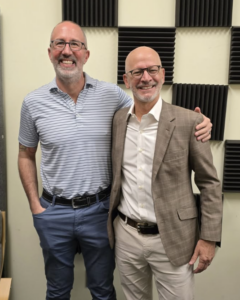 UMW President Paino stands with podcast guest Lou Marmo