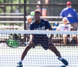 student-athlete playing tennis