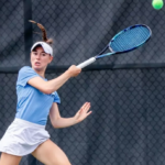 student-athlete playing tennis
