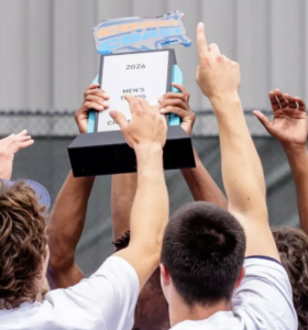 Tennis players hold a trophy