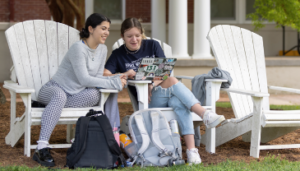 Two UMW students sitting in chairs on Ball Circle