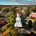 aerial image of UMW campus with bell tower and other buildings visible