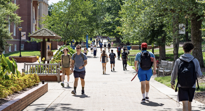 Students walking on campus walk