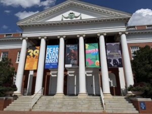 duPont Hall at UMW on a sunny day with banners hanging for the year's productions
